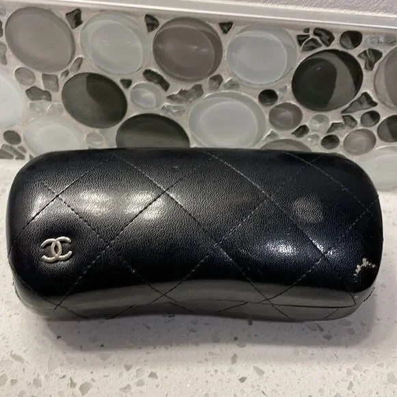 Chanel black leather quilted sunglass case. No sunglasses just the case